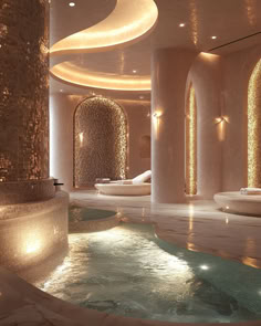 a spa room with an indoor jacuzzi tub and lights on the walls, surrounded by stone columns