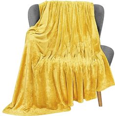 a chair with a yellow blanket on it