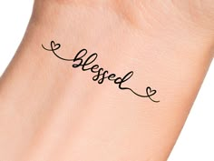 a hand with a tattoo on it that says, blessed