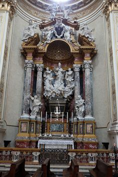 an ornate alter in the middle of a church