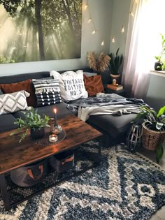 a living room filled with lots of furniture next to a large painting on the wall