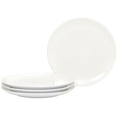 four white plates stacked on top of each other with one plate in the middle and two empty