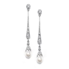 PRICES MAY VARY. LUXURY STYLE: Mariell Vintage Cultured Freshwater Pearl Dangle Bridal Earrings with Cubic Zirconia and Soft Ivory Pearl Drops Set in Silver Platinum, Stainless Steel Posts with Comfort Disk Backs PERFECT SIZE: Graceful and Delicate Wedding Earrings Measures 2" Long, Genuine Silver Platinum Plating with Rhodium, Look of Fine Jewelry QUALITY DESIGN: Top Quality Cubic Zirconia, Lightweight Silhouette for Super Comfortable Day-into-Night Wear MADE WITH LOVE: Designed, Manufactured a Pearl Art, Clean Gold Jewelry, Bridal Jewellery Design, Deco Earrings, Bridal Earrings Pearl, Cubic Zirconia Jewelry, Vintage Pearl, Discount Jewelry, Popular Jewelry