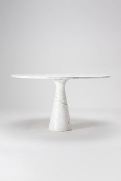 a white marble table on a grey background