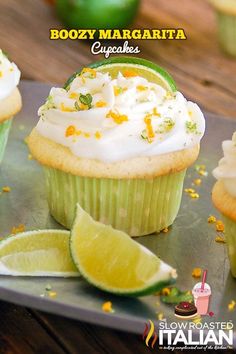 several cupcakes with frosting and lime slices