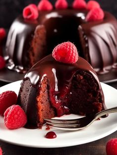 a chocolate bunt cake with raspberries on the side and one slice missing