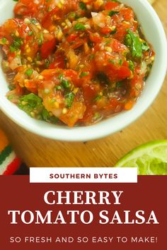 a white bowl filled with salsa next to limes on top of a wooden table