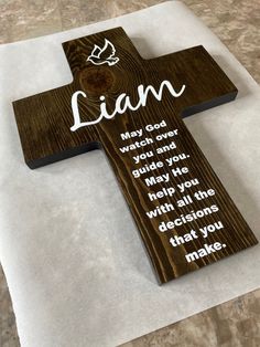 a wooden cross sitting on top of a table