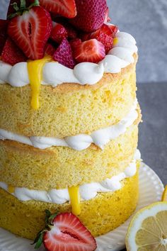 a cake with strawberries and lemon on top