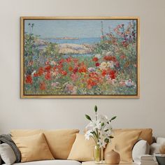 a painting hanging on the wall above a couch in a living room filled with furniture