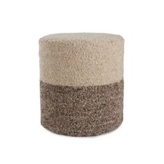 a small stool with two different colors on the top and one is made out of wool