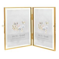 an open gold frame with flowers and leaves on the front is shown in this image