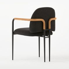 The strong, architectural silhouette of Jannis Ellenberger's dining chair recalls classic Brutalist designs, updated with warm, organic finishes. Matte black armrests are wrapped in a rich Moore andamp; Giles r leather that's tanned using olive leaves for a stunning finish. Seat and backrest are upholstered in a charcoal performance fabric that can stand up to dirt and stains. CB2 exclusive.  -Designed by Jannis Ellenberger -Metal frame with matte black finish -Cryptonr poly-linen performance fa Black Metal Dining Chairs, White Plastic Chairs, Grey Leather Chair, Gold Dining Chairs, Cowhide Chair, Metal Counter Stools, Black Leather Chair, Fabric Dining Chair, Dining Room Arm Chairs