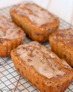 four muffins sitting on top of a cooling rack