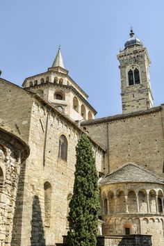 an old stone building with a clock tower