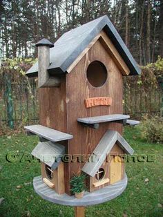 a bird house made out of wooden boards