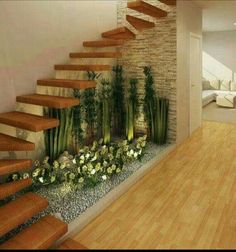 an image of a living room setting with stairs and flowers on the ground in front of it