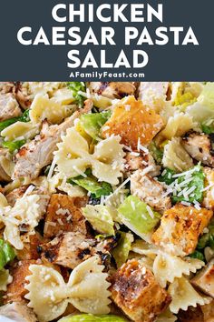 chicken caesar pasta salad with parmesan cheese and lettuce in a white bowl