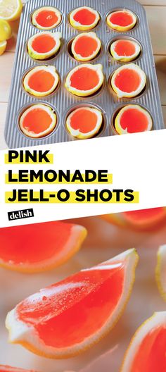 pink lemonade jello shots on a baking sheet with oranges in the background