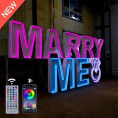 a neon sign that says marry me with remote control next to it and an iphone