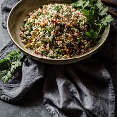 a bowl filled with food sitting on top of a table