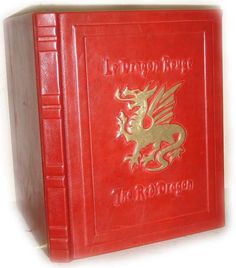 a red book with gold dragon on the front and back cover that reads, liverpool