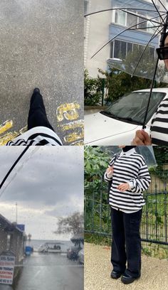 a woman holding an umbrella while standing next to a white car on a rainy day