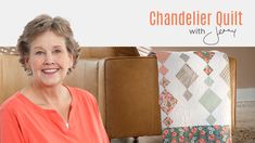 a woman sitting in front of a quilt on a couch with the words chandler quilts