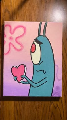 a painting of a blue bug holding a heart on a wooden table with pink flowers