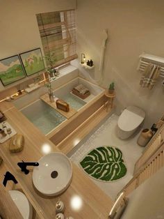 an aerial view of a bathroom with two sinks, toilet and bathtub in it