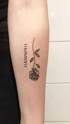 a woman's arm with a tattoo that reads, i am mama and has a rose on it