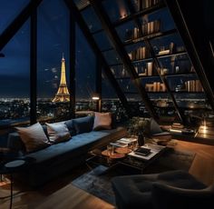 a living room filled with furniture and a view of the eiffel tower at night