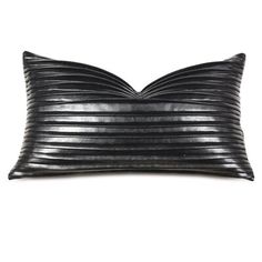 a black leather pillow with pleated lines on the front and back, sitting on a white background