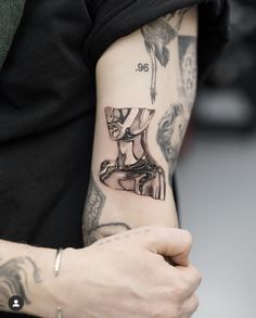 a person with a tattoo on their arm