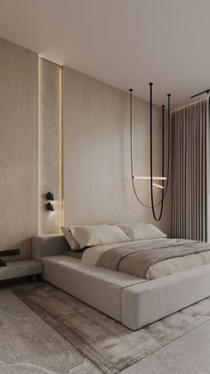 a large bed sitting in the middle of a bedroom next to a wall mounted light