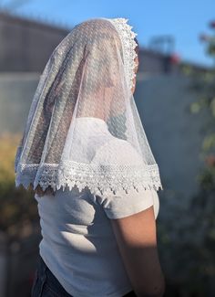 This is a D Shape Veil. This veil was made with a soft dot mesh lace fabric and is embellished with an offwhite trim around the edges.  It measures approx  38 x 19 inches The veil includes a sewn-in clip.  Veils are all handmade so no two pieces will be identical.  Please allow 3-7 business days for the order to be processed and shipped. Washing recommendations: Wash with cold or warm water by hand. Hand dry or tumble dry in low-medium heat. We recommend washing the veil before being used since the fabric was not prewashed before making the veil. If you have any questions about this veil don't hesitate to message me. Please keep in mind that the color may vary due to differences in computer/phone screens. I do accept returns the return window is 7 days therefore contact me as soon as possi White Lace With Lace Collar For Spring, Fitted White Veil, White Lace Trim Tulle, White Fitted Lace Veil, White Lace With Contrast Detail For Summer, Fitted Sheer White Veil, Fitted White Lace Veil, White Sheer Lace For Spring, Spring Sheer White Lace