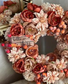 a close up of a wreath with flowers on it