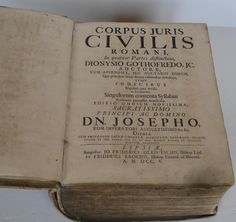 an old book with some writing on it's cover and the title page in spanish