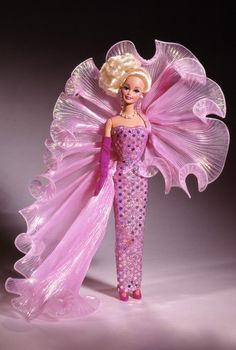 a barbie doll dressed in pink and purple