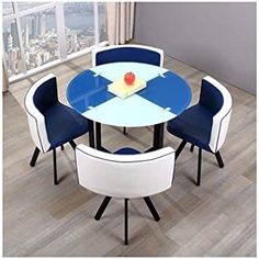 a round table with four chairs around it and a view of the city from across the room