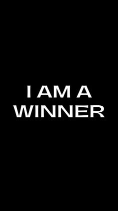 the words i am a winner against a black background