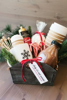 a basket filled with hot chocolates, marshmallows and candy canes