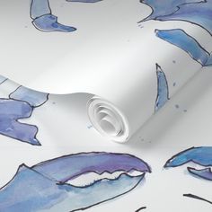 a blue and white wallpaper with watercolor paint on it