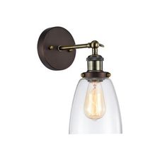 an old fashioned wall light with a glass shade on the side and a metal arm