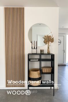 a room with a shelf, mirror and basket on it in front of a striped wall