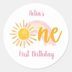 a round sticker with the words first birthday written in pink, yellow and orange