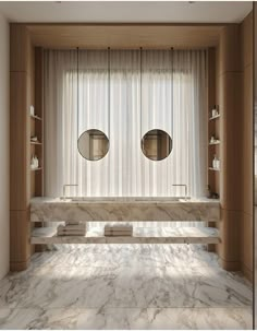 a bathroom with marble counter tops and two round mirrors on the wall above it's windows