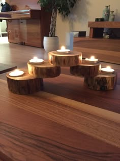 candles are arranged in the shape of circles on a table