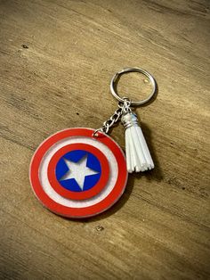 the captain's shield keychain has a tasseled star on it