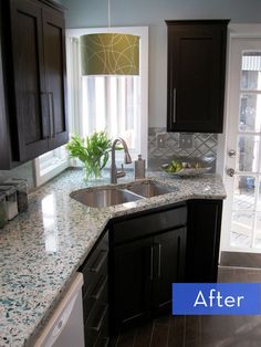 a kitchen with granite counter tops and dark wood cabinets, before and after remodeling